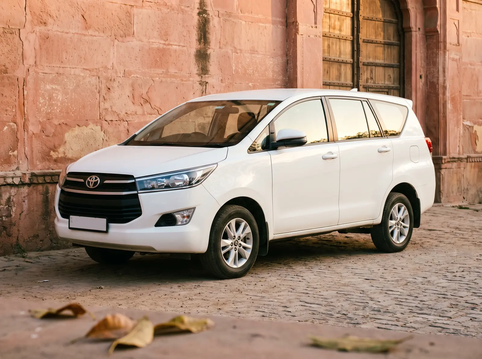 White Innova Crysta cab