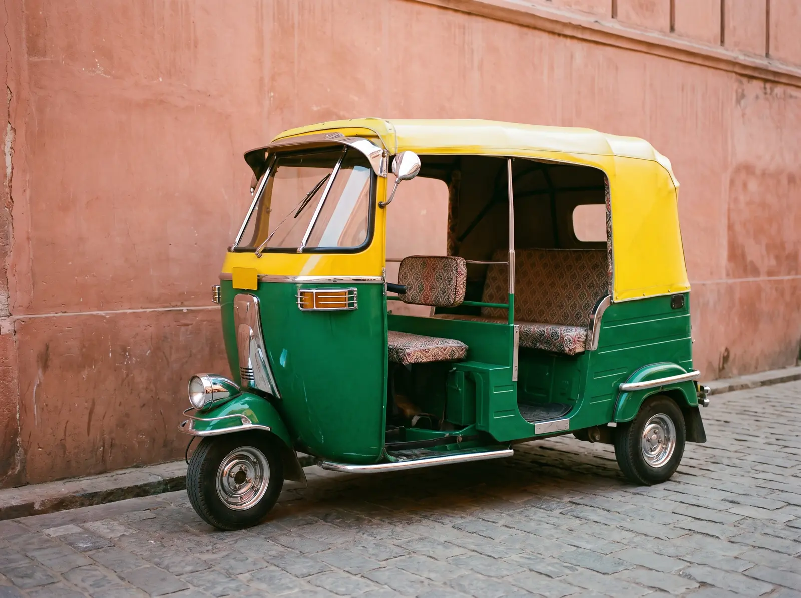The green-and-yellow tuk-tuk